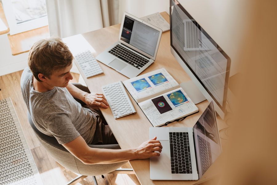 Person updating information across computers at a workstation